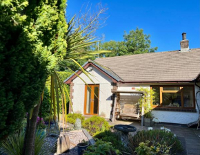 Coastal garden annex with log fire & summer house